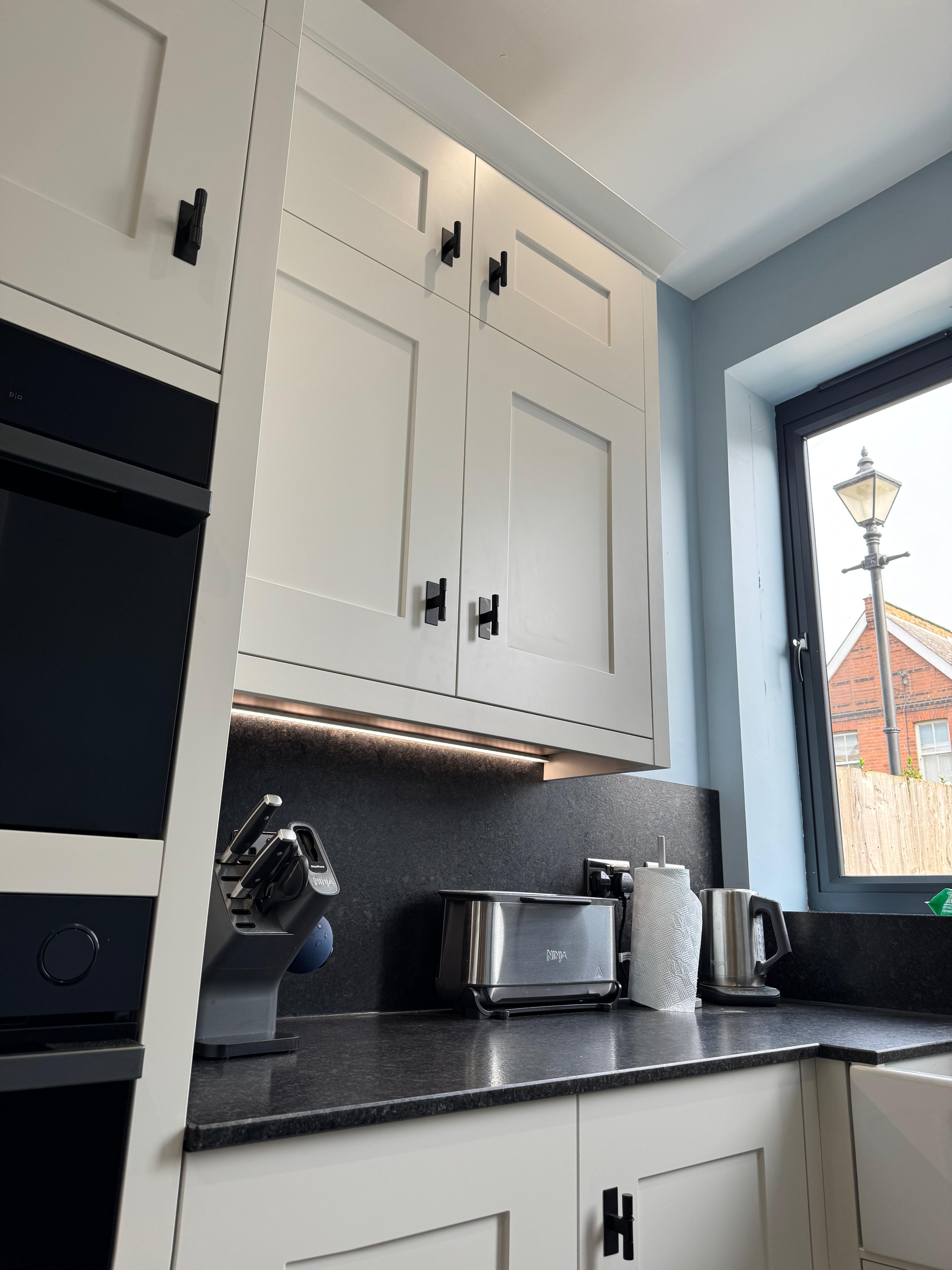 White shaker kitchen with under-cabinet lighting