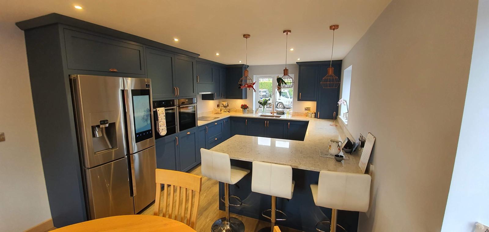 Blue kitchen panoramic view with breakfast bar