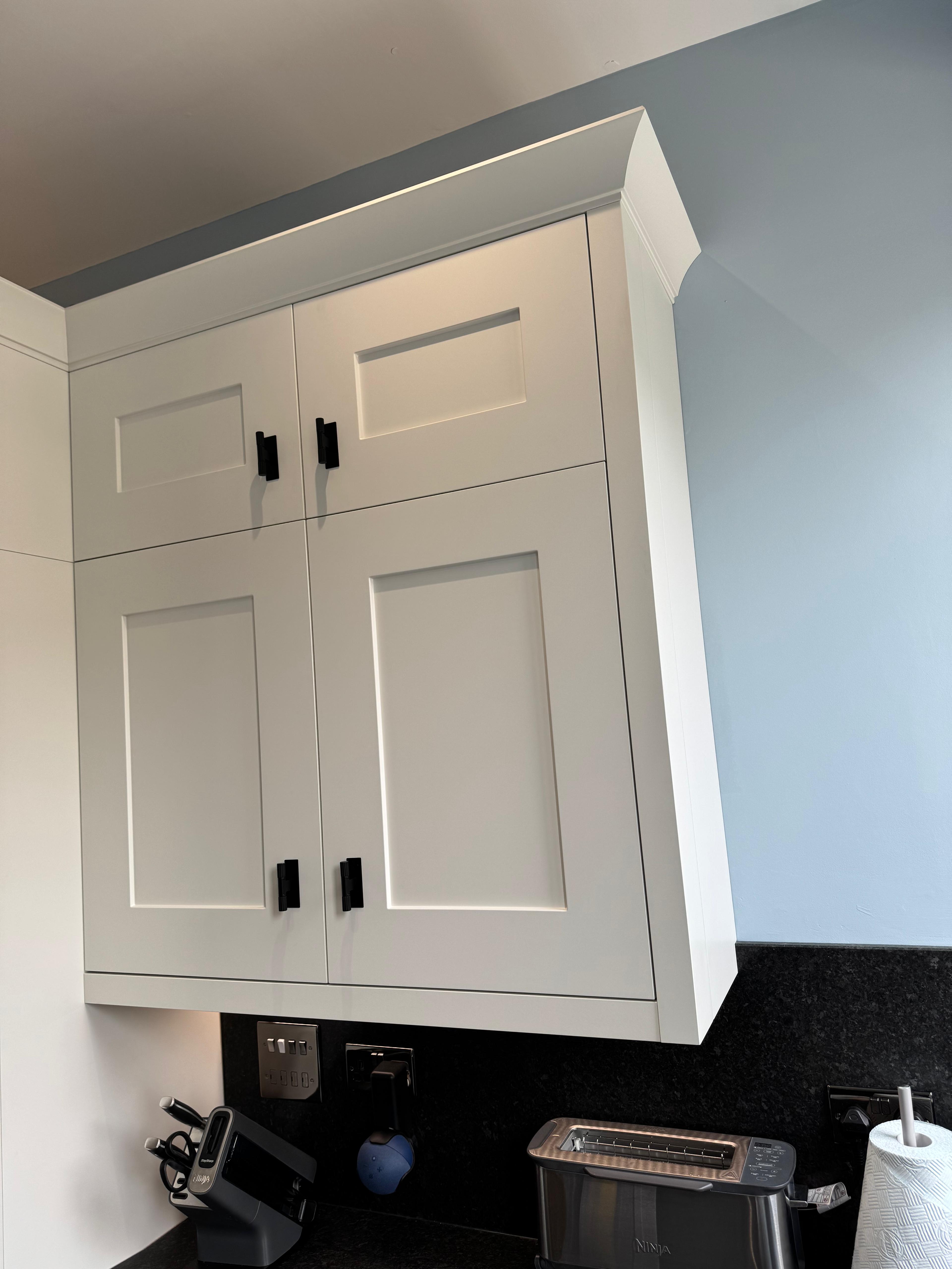 White shaker kitchen wall cabinets detail