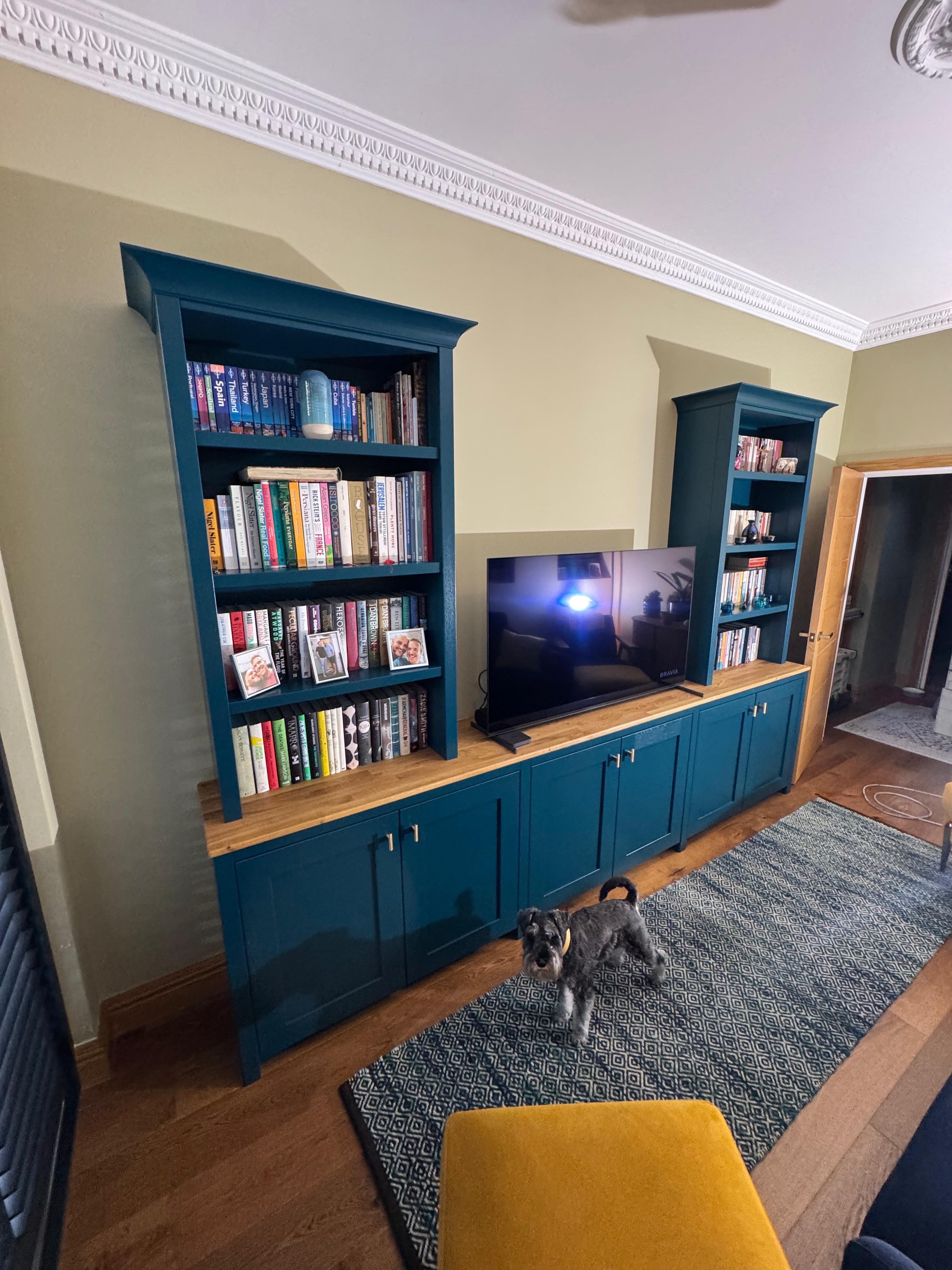 Teal painted media unit full room view